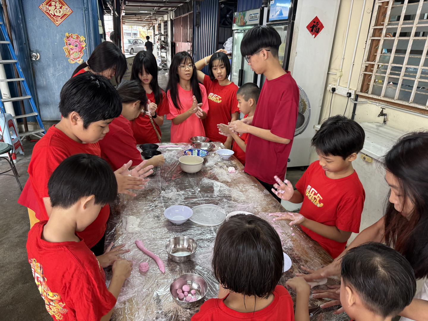 YYC Volunteers and kids making tangyuan